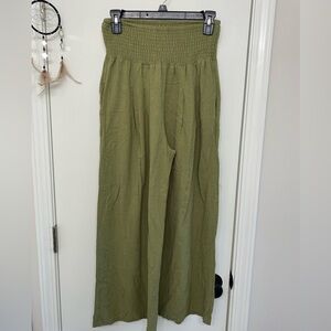 Wide leg, high waisted green pants with pockets.